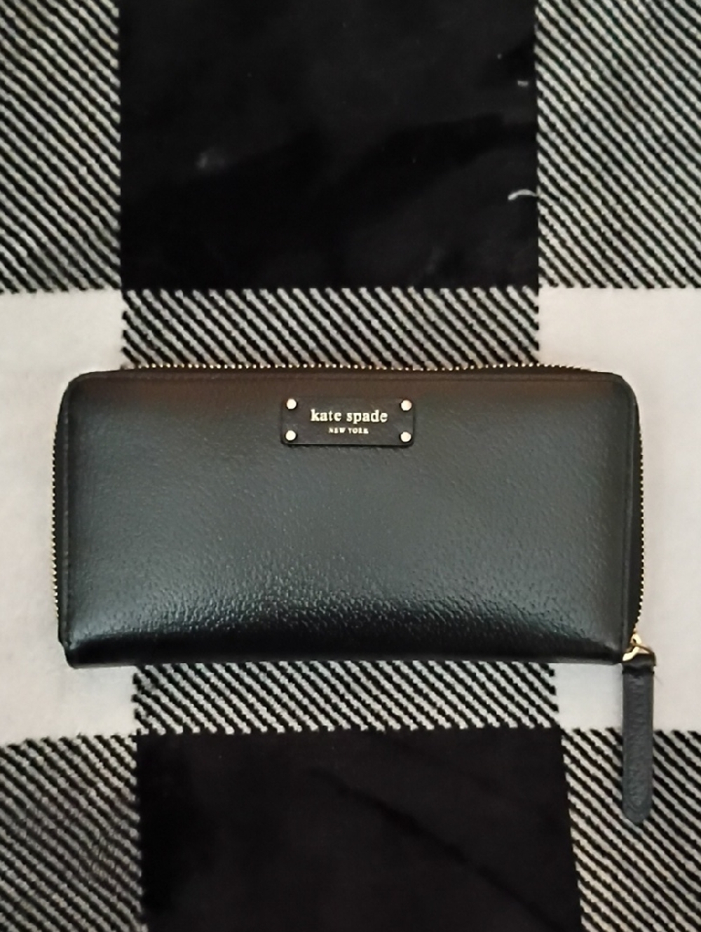 kate spade black leather zip-around wallet with gold-tone plaque